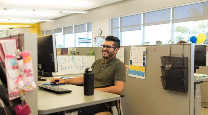 A male employee working at UCPath